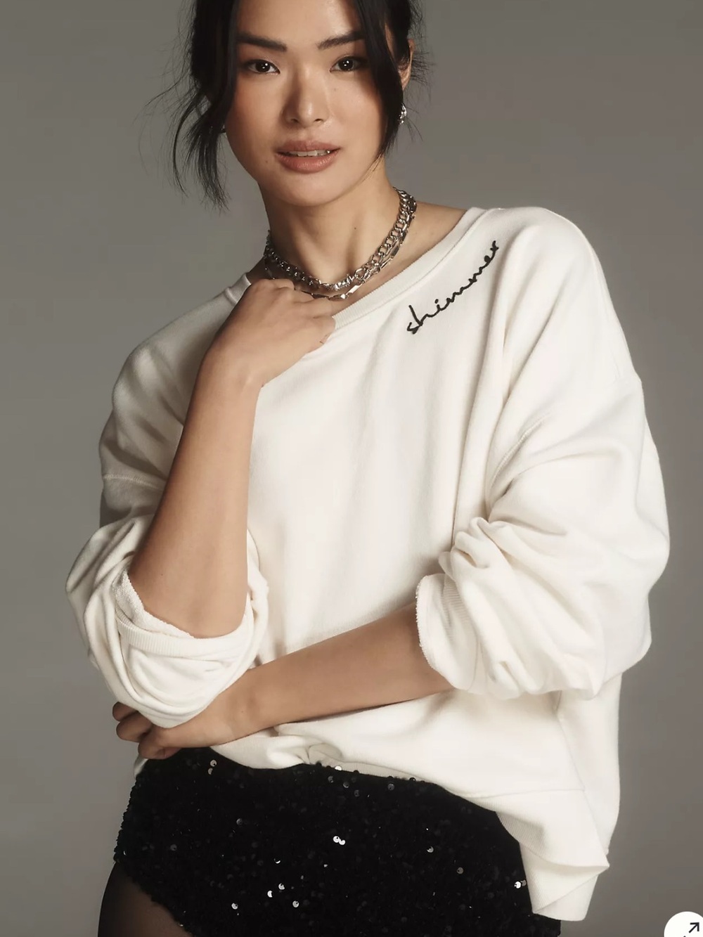 This cream Pilcro embroidered sweatshirt from Anthropologie features a "shimmer - Picture 3 of 12